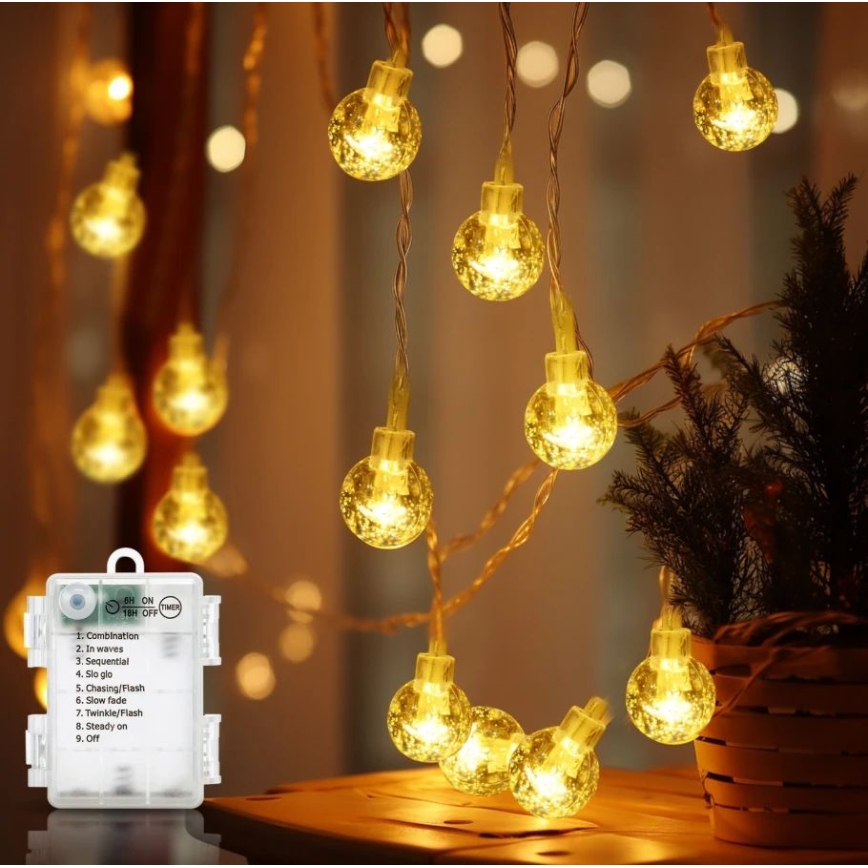 Aigostar - Corrente exterior de Natal LED 100xLED/3xAA/8 funções 10,3 m IP44 branco quente